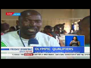 a man in a white shirt is interviewed on a tv screen